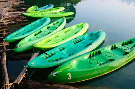 kayaks in lake on Ratchaprapa Dam,Khao Sok,Thailandの写真素材