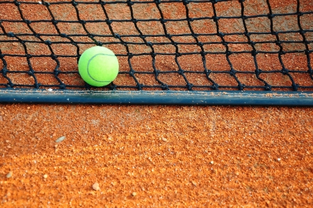 Tennis ball on a tennis clay courtの写真素材