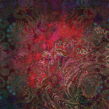 floral pattern on worn dark red  backgroundの写真素材