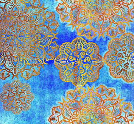 golden  floral pattern on textured blue backgroundの写真素材