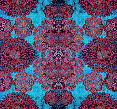 red lace floral pattern on textured blue backgroundの写真素材