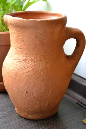 earthen jar on the kitchen window sillの写真素材