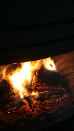 fire flames in black chimney frameの写真素材