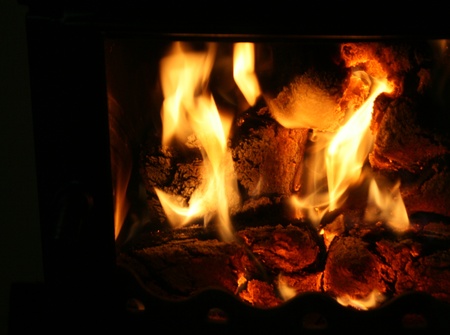 fire flames in black chimney frameの写真素材