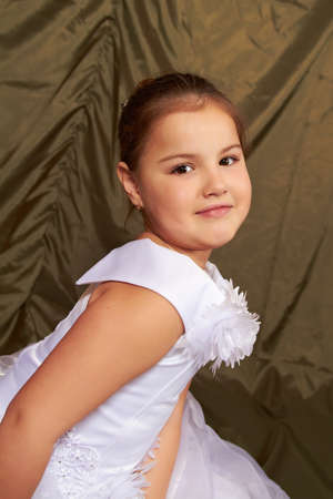 A little girl sits pensively.の写真素材