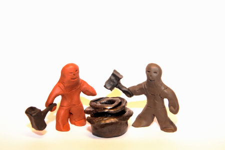 Two blacksmith figures and a metal roseの写真素材