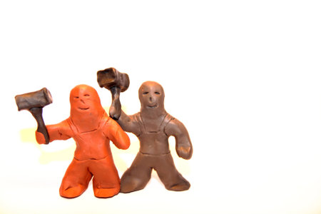 Two blacksmith figures holding hammersの写真素材