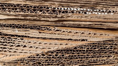 stacked brown paperboard with asymmetryic patternの写真素材
