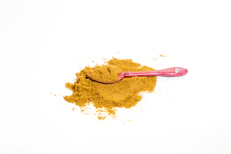 Isolated a spoon of cinnamonの写真素材