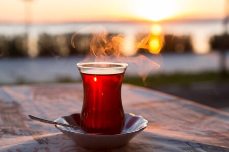Turkish tea with reverse light image during the sunset for designの写真素材