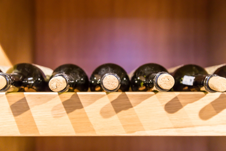 Wine bottles on the rack with horizontal positionの写真素材