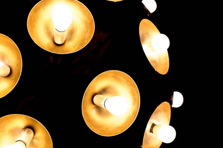 Several light bulbs with dark background for design