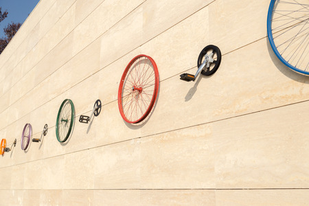 Wheel rim parts of bicycle on the wallの写真素材