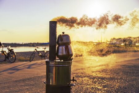 Traditional Turkish Tea Urn near the sea during the sunsetの写真素材