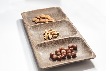 Isolated dried nuts and fruits with shallow depth of field