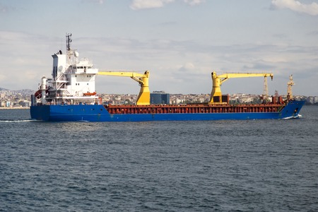 Big size commercial ship view from Istanbul Bosphorus with blue sky