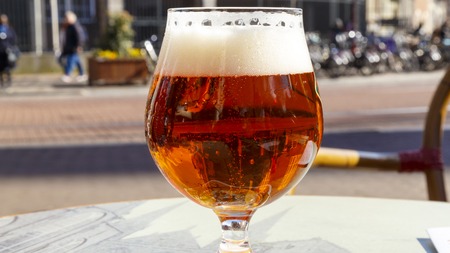 Close up glass of beer view with the bubbles