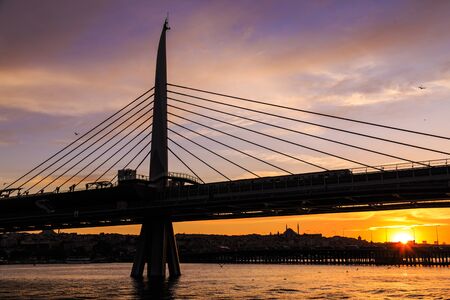 Silhouette view of Istanbul metro bridge during the sunset with reverse lightの写真素材