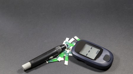 checking blood glucose for treatment studio image