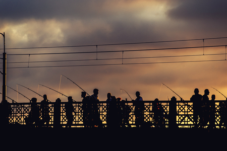 Silhouette view of fishermen from Halic Bridge of Istanbulの写真素材