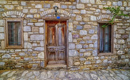 Empty Stone wall with window for background and designの写真素材