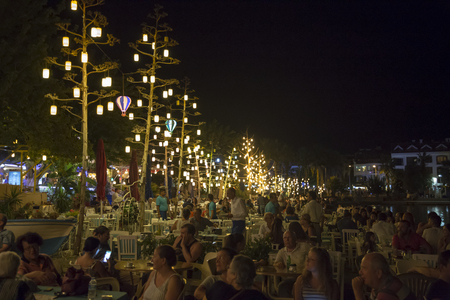 Elegant people having dinner near the sea at open air restaurantのeditorial素材