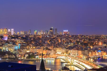 Istanbul view from down town of the city during the twilight with beatiful atmospheric blue sky and city lightsの写真素材
