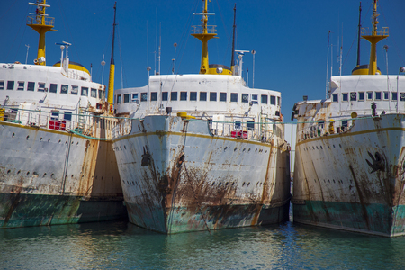 Abandoned old ships in a lineの写真素材