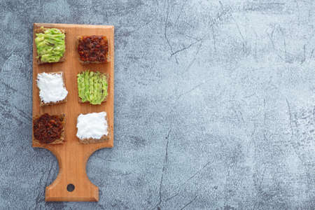 Flat lay top view of bread bites with several tapas copy space includeの写真素材