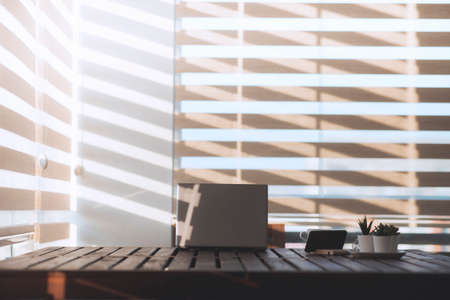An empty home office view during early morning with beautfiful and modern lighting.の写真素材
