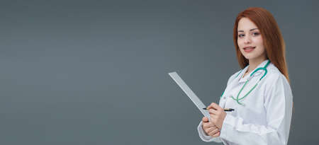 Beautiful smiling Turkish young woman, mobile phone concept. She is checking her mobile phone.の写真素材