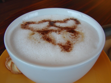 A cup of cocoa coffee brown with three hearts outの写真素材