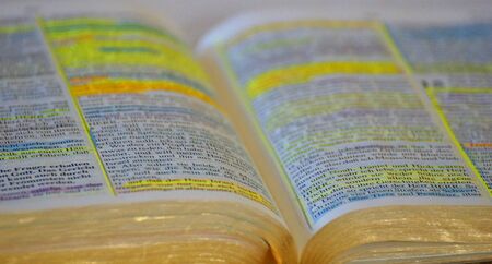 background open Bible with markingsの写真素材