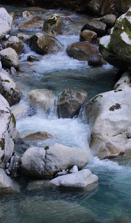 beautiful wild brook between stones and rocksの写真素材