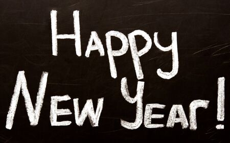 Happy New Year message greeting handwriting on a blackboardの写真素材