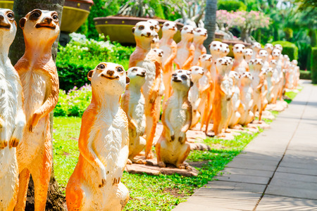 CHONBURI, THAILAND - March 18, 2016: Beautiful garden decoration in Nong Nooch Tropical Botanical Garden. Many meerkats. Nong Nooch Tropical Botanical Garden is a 500-acre botanical garden in Chonburi, Thailand. Selective focusのeditorial素材