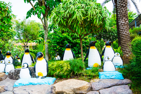 CHONBURI, THAILAND - March 18, 2016: Beautiful garden decoration in Nong Nooch Tropical Botanical Garden. Many penguins. Nong Nooch Tropical Botanical Garden is a 500-acre botanical garden in Chonburi, Thailand. Selective focusのeditorial素材
