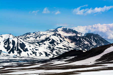 Peaks of mountains above the clouds, Russia, Kamchatka. Selective focusの写真素材