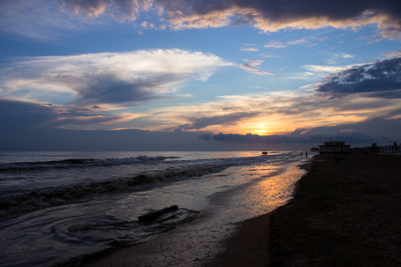 sun sinks into the seaの写真素材