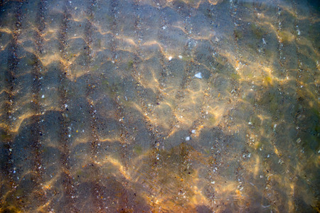 Sun glare on the waterの写真素材