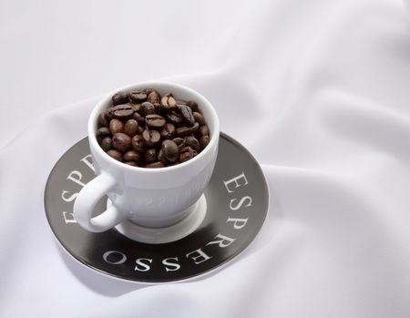 Espresso cup with whole coffee beansの写真素材