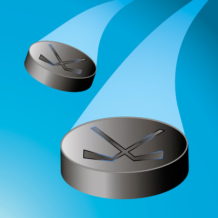Two flying hockey puck to the left with a trainの写真素材