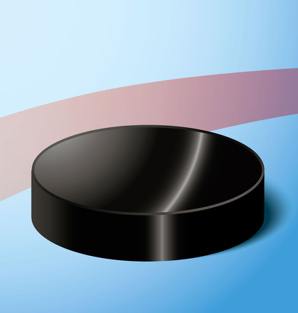 hockey puck on the red markings of blue iceの写真素材