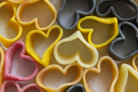 pasta in the form of hearts, different colors, before cookingの写真素材