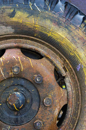 Close-up of old painters truck wheel and tire.