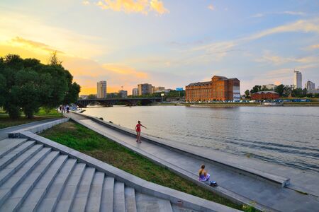The embankment of the Iset river in Yekaterinburg in the evening at sunsetの写真素材