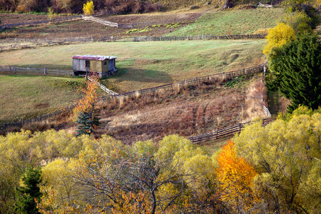 Autumn in the Rhodope Mountains, Bulgaria. In the middle of the woods small fields with fences. Mountain landscape.の写真素材