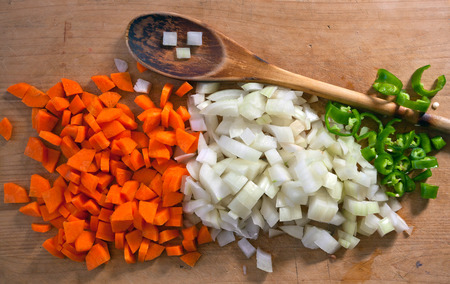 Sliced carrots, onions and peppers. Fresh vegetables. Cooking spices.の写真素材