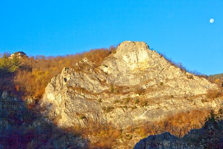 House on a rock. The sun is rising.の写真素材