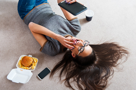 Beautiful young woman using a tablet